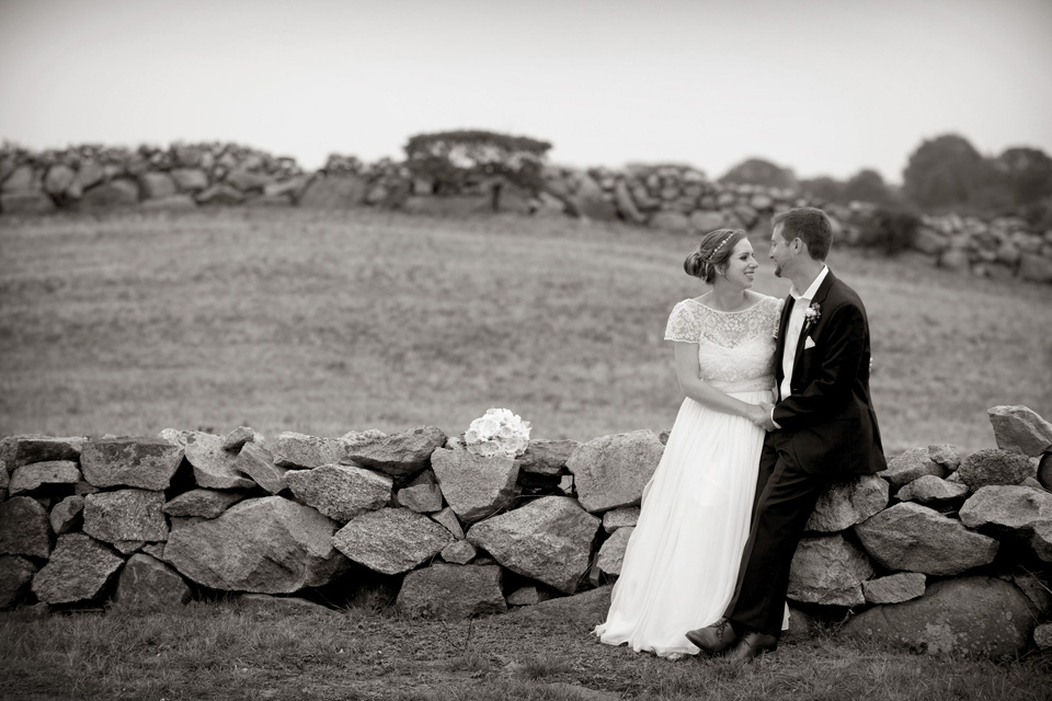 Enjoying the stone wall at a Rose Farm Inn Block Island Wedding
