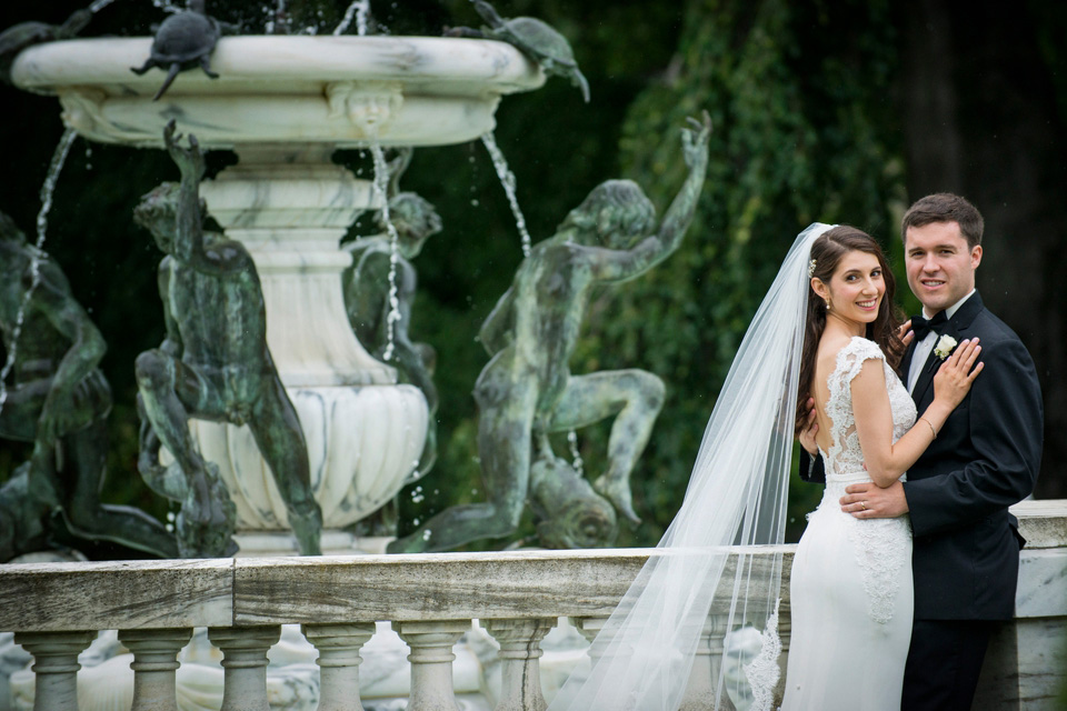 Bride and Groom by the fountain at The Elms Mansion